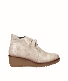 Beige embossed leather wedge ankle boots