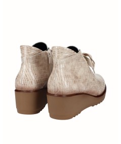 Beige embossed leather wedge ankle boots