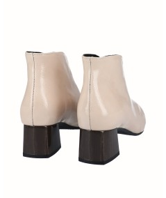 Beige patent leather high-heeled ankle boots